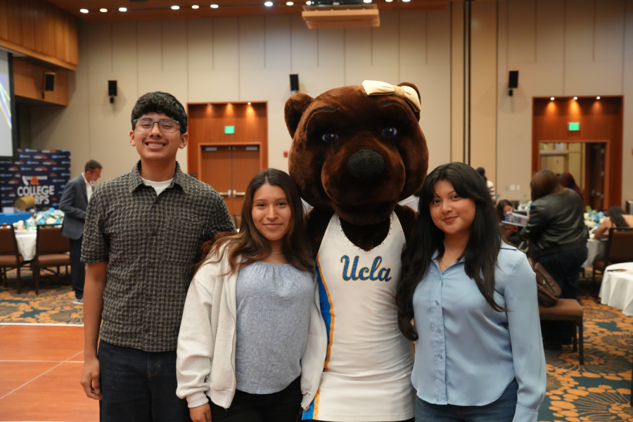 Image with three students and Josie Bruin